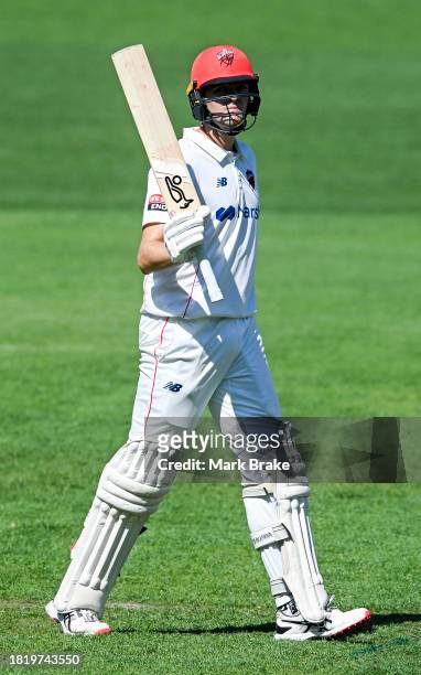 Liam Scott of the Redbacks celebrates making his half century during the Sheffield Shield match between South Australia and Victoria at Adelaide...