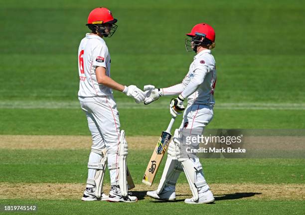 Liam Scott of the Redbacks celebrates making his half century with s23during the Sheffield Shield match between South Australia and Victoria at...