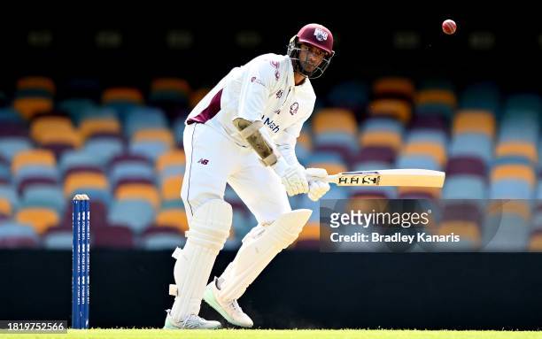 Gurinder Sandhu of Queensland plays a shot during day two of the Sheffield Shield match between Queensland and Western Australia at The Gabba, on...