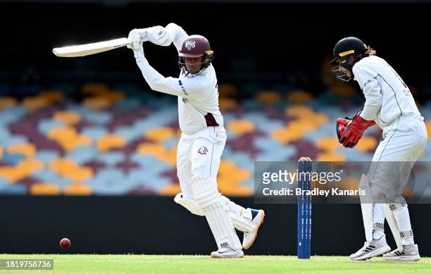 Usman Khawaja of Queensland plays a shot during day two of the Sheffield Shield match between Queensland and Western Australia at The Gabba, on...
