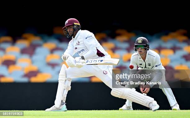 Gurinder Sandhu of Queensland plays a shot during day two of the Sheffield Shield match between Queensland and Western Australia at The Gabba, on...