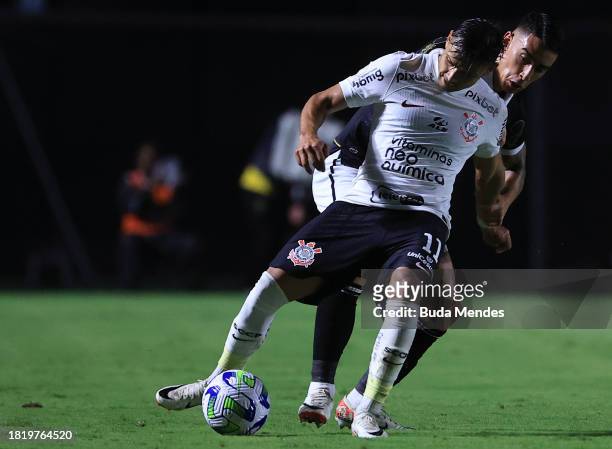 Romero of Corinthians fights for the ball with Puma Rodriguez of Vasco during the match between Vasco Da Gama and Corinthians as part of Brasileirao...