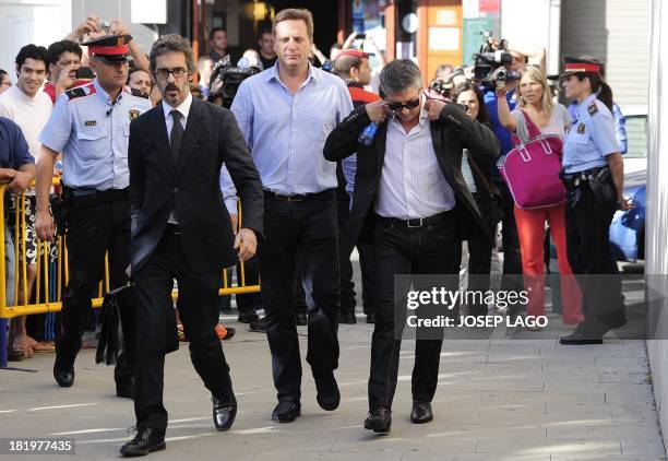 Jorge Horacio Messi father of Barcelona football star Lionel Messi and his lawyer Cristobal Martell arrive to the courhouse in the coastal town of...