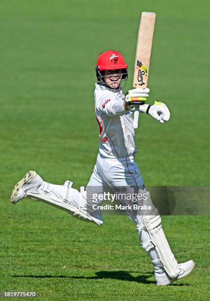 Jake Fraser-McGurk of the Redbacks celebrates bringing up his century during the Sheffield Shield match between South Australia and Victoria at...
