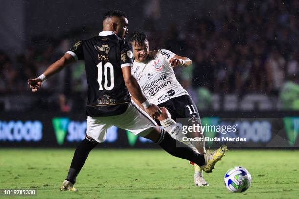Romero of Corinthians fights for the ball with Payet of Vasco during the match between Vasco Da Gama and Corinthians as part of Brasileirao 2023 at...