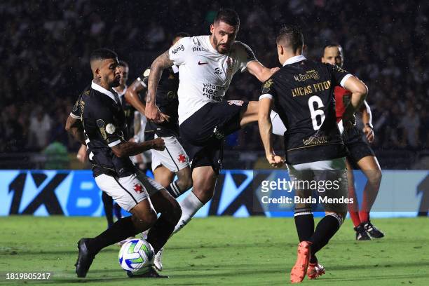 Renato Augusto of Corinthians fights for the ball with Paulinho and Lucas Piton of Vasco during the match between Vasco Da Gama and Corinthians as...