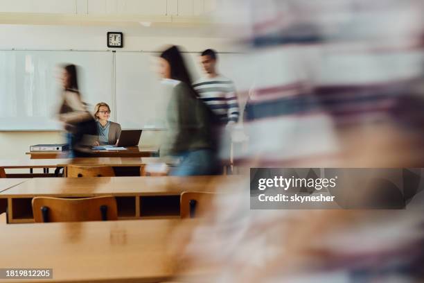 entering the classroom in blurred motion! - university classroom stock pictures, royalty-free photos & images