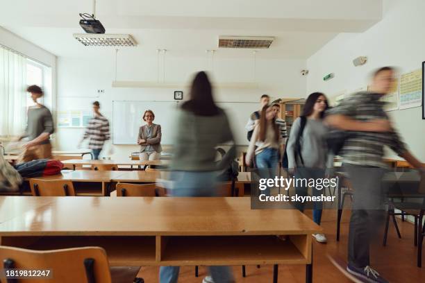 finding the seat before the start of the class! - teacher taking attendance stock pictures, royalty-free photos & images