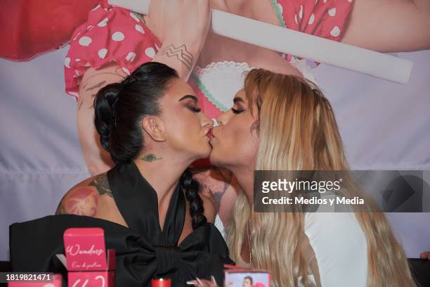 Yered Licona of Wander Lovers, Wendy Guevara kisses during a Press conference the presentation `Wanders´ Perfume, at Teatro Centenario Coyoacan on...