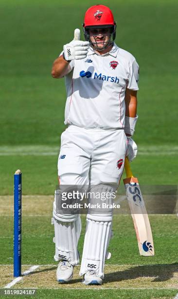 Ben Manenti of the Redbacks celebrates making his half century during the Sheffield Shield match between South Australia and Victoria at Adelaide...