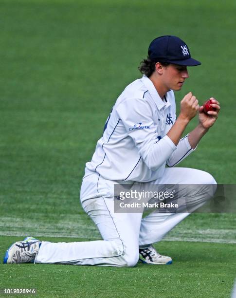 Doug Warren of the Bushrangers catches Nathan McAndrew of the Redbacks during the Sheffield Shield match between South Australia and Victoria at...