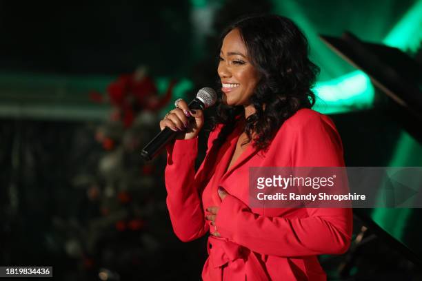 Tatyana Ali performs onstage during a Holiday Celebration with the Stars of "It's A Wonderful Lifetime", joining together to honor military spouses...