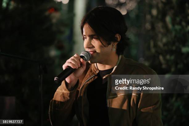 Max Ehrich performs onstage during a Holiday Celebration with the Stars of "It's A Wonderful Lifetime", joining together to honor military spouses...
