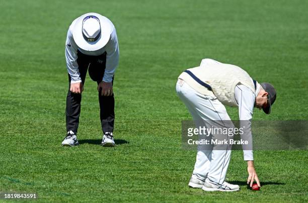 Umpire Mike Graham-Smith reacts to being hit by the ball from Jake Fraser-McGurk of the Redbacks during the Sheffield Shield match between South...