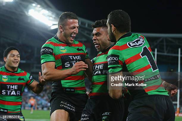 Nathan Merritt of the Rabbitohs celebrates with his team after scoring a try during the NRL Preliminary Final match between the South Sydney...