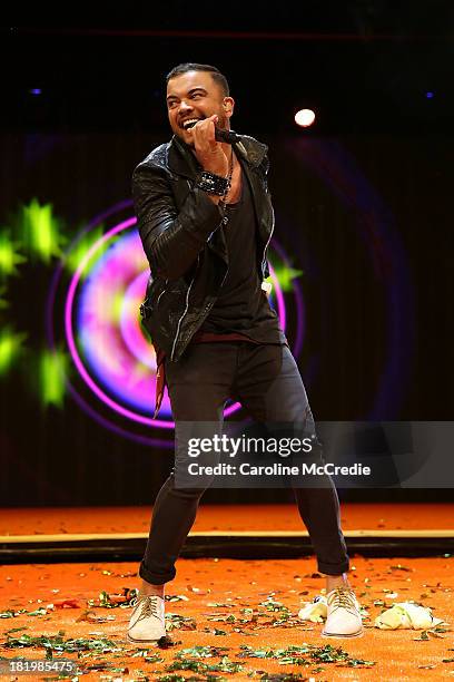 Guy Sebastian performs during the Nickelodeon Slimefest 2013 evening show at Sydney Olympic Park Sports Centre on September 27, 2013 in Sydney,...