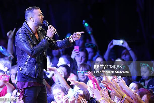 Guy Sebastian performs during the Nickelodeon Slimefest 2013 evening show at Sydney Olympic Park Sports Centre on September 27, 2013 in Sydney,...