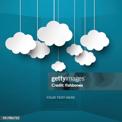 White clouds hand from strings on blue background White clouds hand from strings on blue background