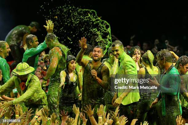 Guy Sebastian throws slime into the crowd during the Nickelodeon Slimefest 2013 evening show at Sydney Olympic Park Sports Centre on September 27,...