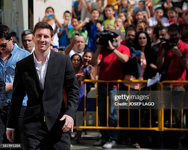 Barcelona football star Lionel Messi and his brother Rodrigo leave the courhouse in the coastal town of Gava near Barcelona on September 27, 2013...