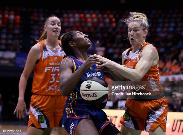 Jocelyn Willoughby of the Lightning is blocked during the WNBL match between Townsville Fire and Adelaide Lightning at Townsville Entertainment...
