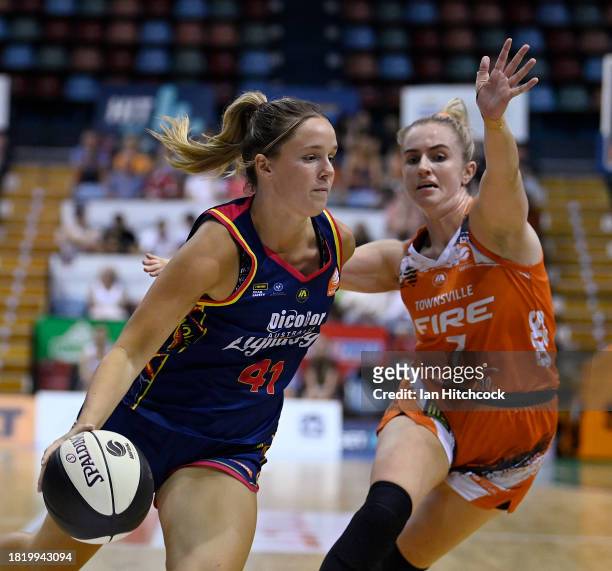 Tayla Brazel of the Lightning drives to the basket during the WNBL match between Townsville Fire and Adelaide Lightning at Townsville Entertainment...