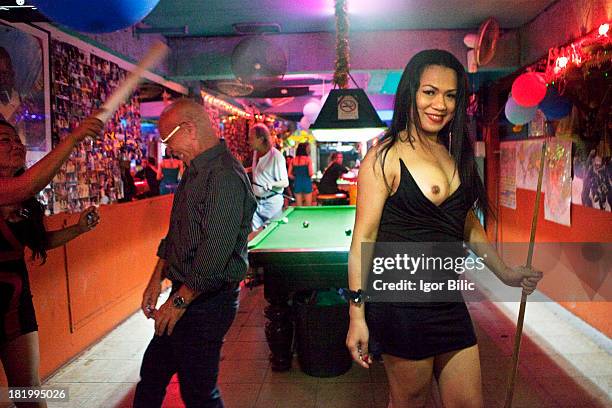 Ladyboy sex worker looking for customers in a bar in Soi Crocodile on Bangla Road, Patong Beach, Phuket island, Thailand. Once small fishing villages...