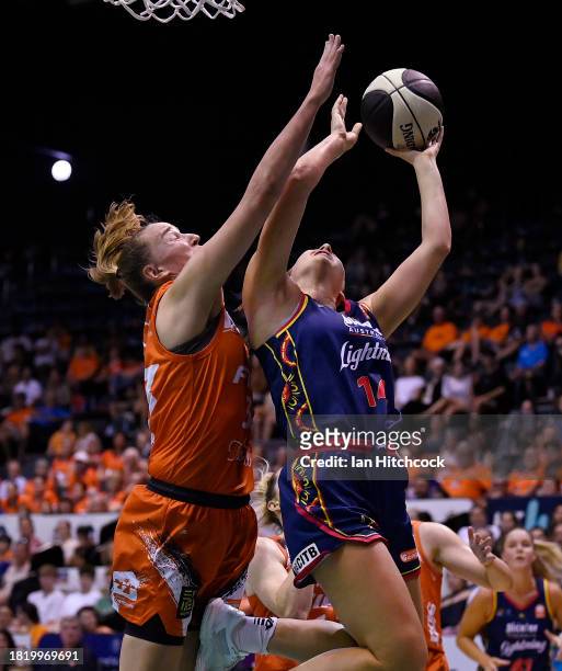 Isobel Borlase of the Lightning drives to the basket during the WNBL match between Townsville Fire and Adelaide Lightning at Townsville Entertainment...
