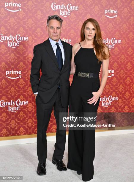 Adrian Pasdar and Amanda Righetti attend the World Premiere of Amazon Prime Video's "Candy Cane Lane" at Regency Village Theatre on November 28, 2023...