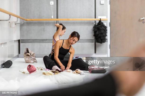 ballet dancers preparing for training - ballet studio stock pictures, royalty-free photos & images