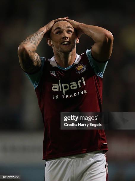 Jack Collison of West Ham reacts during the Capital One Cup third round match between West Ham United and Cardiff City at the Boleyn Ground on...