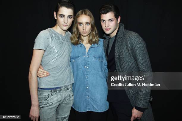 Harry Brant, Olga Sorokina and Peter Brant pose backstage after the IRFE show as part of the Paris Fashion Week Womenswear Spring/Summer 2014 on...