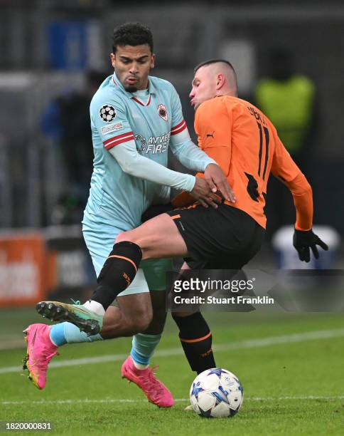 Oleksandr Zubkov of Shakhtar is challenged by Owen Wijndal of Antwerp during the UEFA Champions League match between Shakhtar Donetsk and Royal...