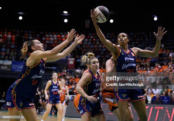 Brianna Turner of the Lightning collects a rebound during the WNBL match between Townsville Fire and Adelaide Lightning at Townsville Entertainment...