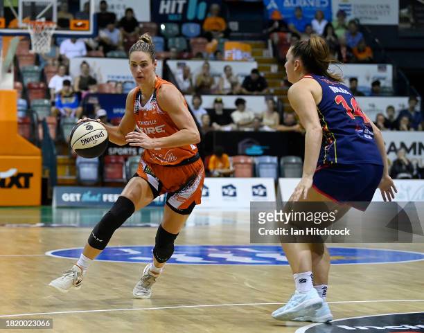 Alice Kunek of the Fire drives to the basket during the WNBL match between Townsville Fire and Adelaide Lightning at Townsville Entertainment Centre,...