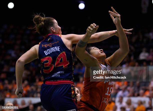 Zitina Aokuso of the Fire is blocked by Isabelle Bourne of the Lightning during the WNBL match between Townsville Fire and Adelaide Lightning at...