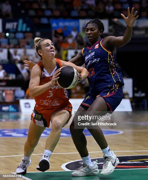 Steph Reid of the Fire drives to the basket during the WNBL match between Townsville Fire and Adelaide Lightning at Townsville Entertainment Centre,...