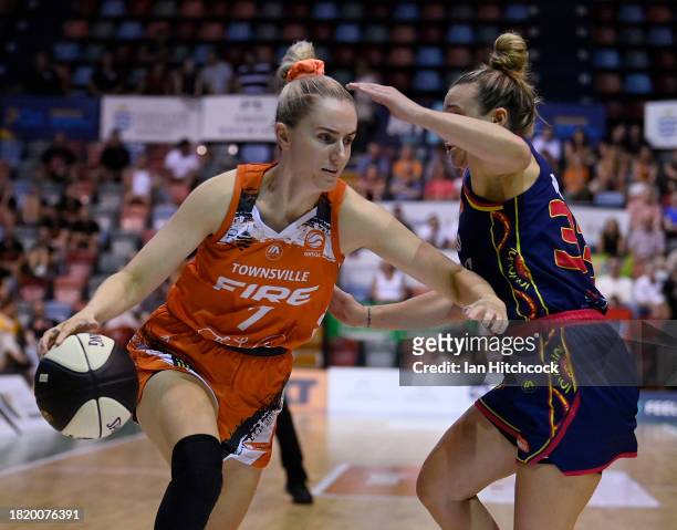 Courtney Woods of the Fire drives to the basket during the WNBL match between Townsville Fire and Adelaide Lightning at Townsville Entertainment...