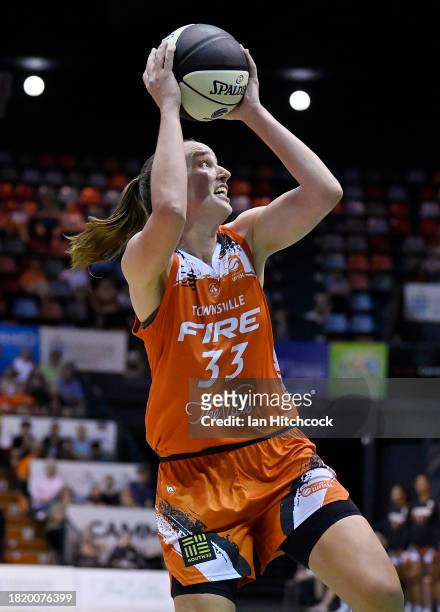 Mikaela Ruef of the Fire takes a shot during the WNBL match between Townsville Fire and Adelaide Lightning at Townsville Entertainment Centre, on...