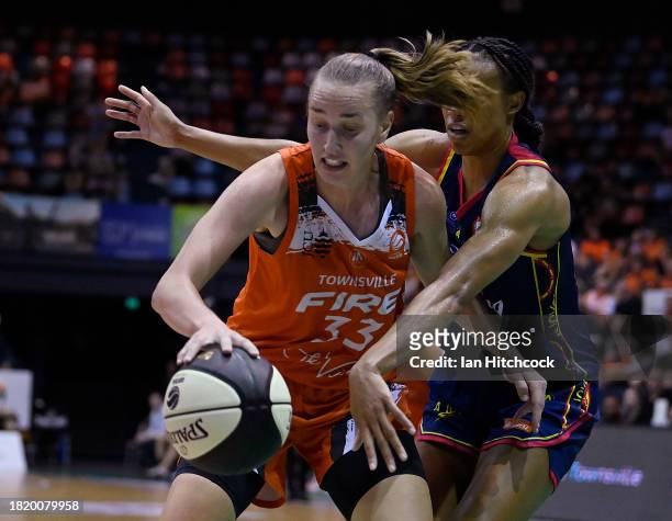 Mikaela Ruef of the Fire contests the ball with Brianna Turner of the Lightning during the WNBL match between Townsville Fire and Adelaide Lightning...