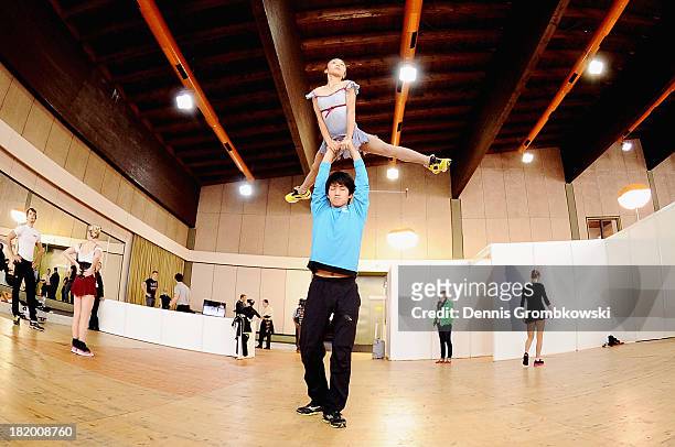 Narumi Takahashi and Ryuichi Kihara of Japan warm up prior to the Pair's Free Skating competition during day two of the ISU Nebelhorn Trophy at...