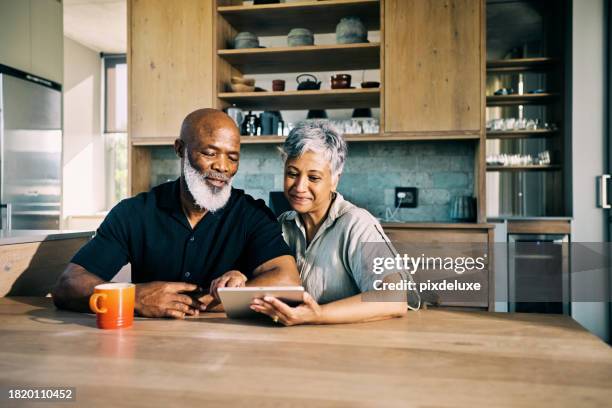 senior african-american couple happy with their retirement plans - financial planning stock pictures, royalty-free photos & images