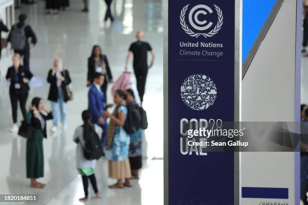 Banner hangs in a venue at the UNFCCC COP28 Climate Conference the day before its official opening on November 29, 2023 in Dubai, United Arab...