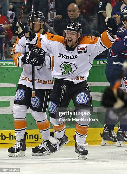 Vincenz Mayer of Wolfsburg jubilates after scoring the first goal during the DEL match between EHC Eisbaeren Berlin and Grizzly Adams Wolfsburg at O2...