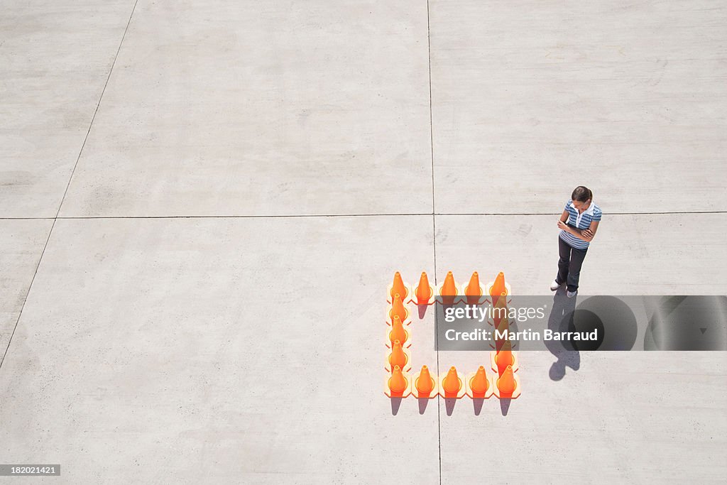 Woman outside box of traffic cones