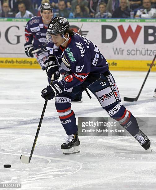 Daniel Weiss of Berlin runs with the puck during the DEL match between EHC Eisbaeren Berlin and Grizzly Adams Wolfsburg at O2 World stadium on...