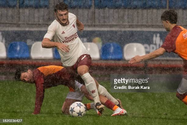 Jack Kingdon of Manchester United fights for the ball during the UEFA Youth League match between Galatasaray A.S. And Manchester United at on...