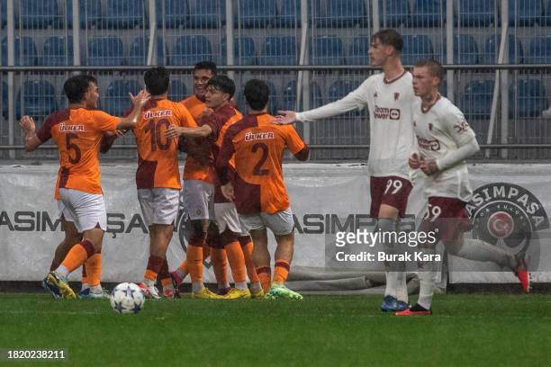 Galatasaray players celebrate Baran Demiroglu's goal during the UEFA Youth League match between Galatasaray A.S. And Manchester United at on November...