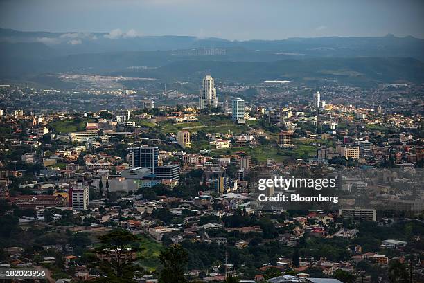 The Sky Residence Club, center, the tallest building in the city, stands in Tegucigalpa, Honduras, on Tuesday, Sept. 3, 2013. Economic growth in...