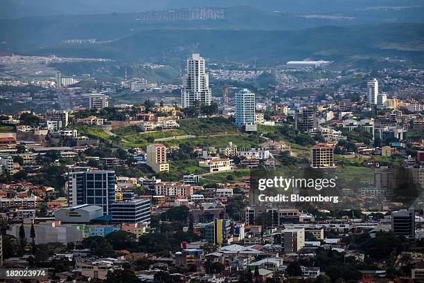 The Sky Residence Club, center, the tallest building in the city, stands in Tegucigalpa, Honduras, on Tuesday, Sept. 3, 2013. Economic growth in...